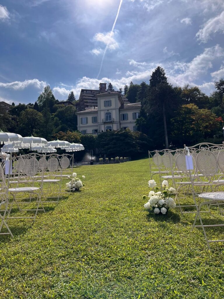 Wedding ceremony setup at Villa Muggia in Stresa with white roses and hydrangeas