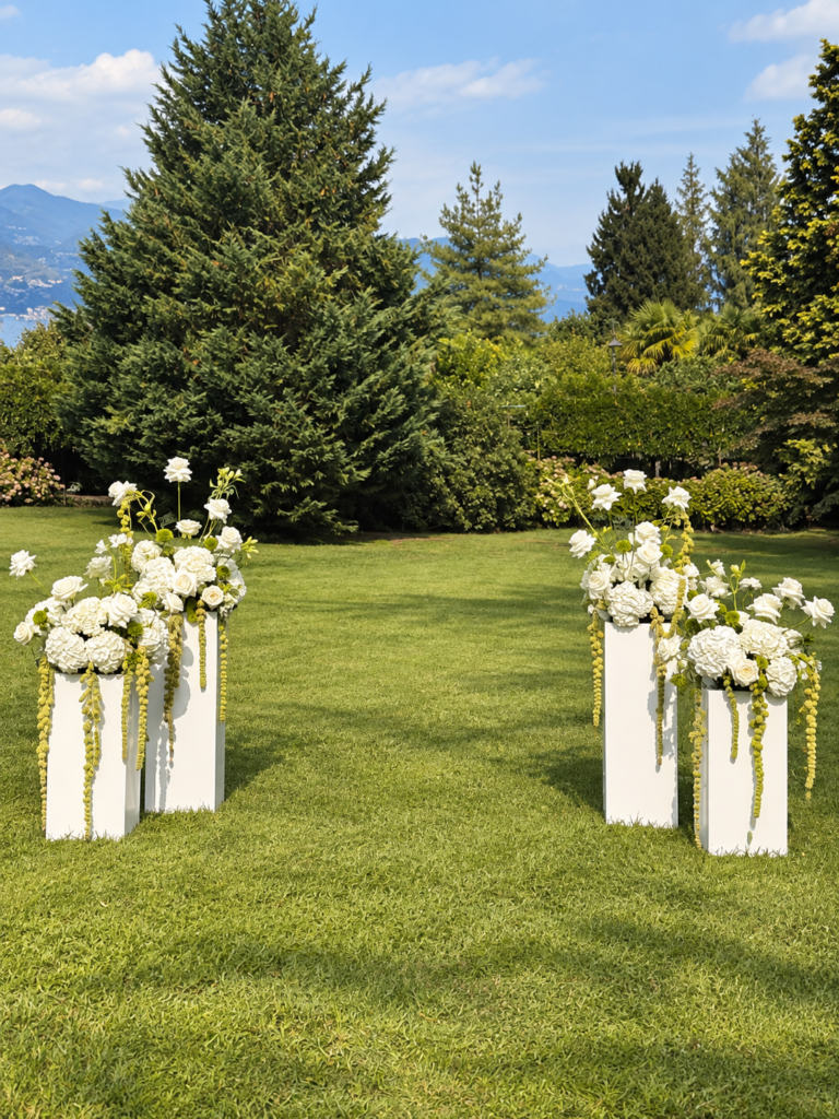 Villa Muggia wedding ceremony in Stresa with white and green floral arrangements